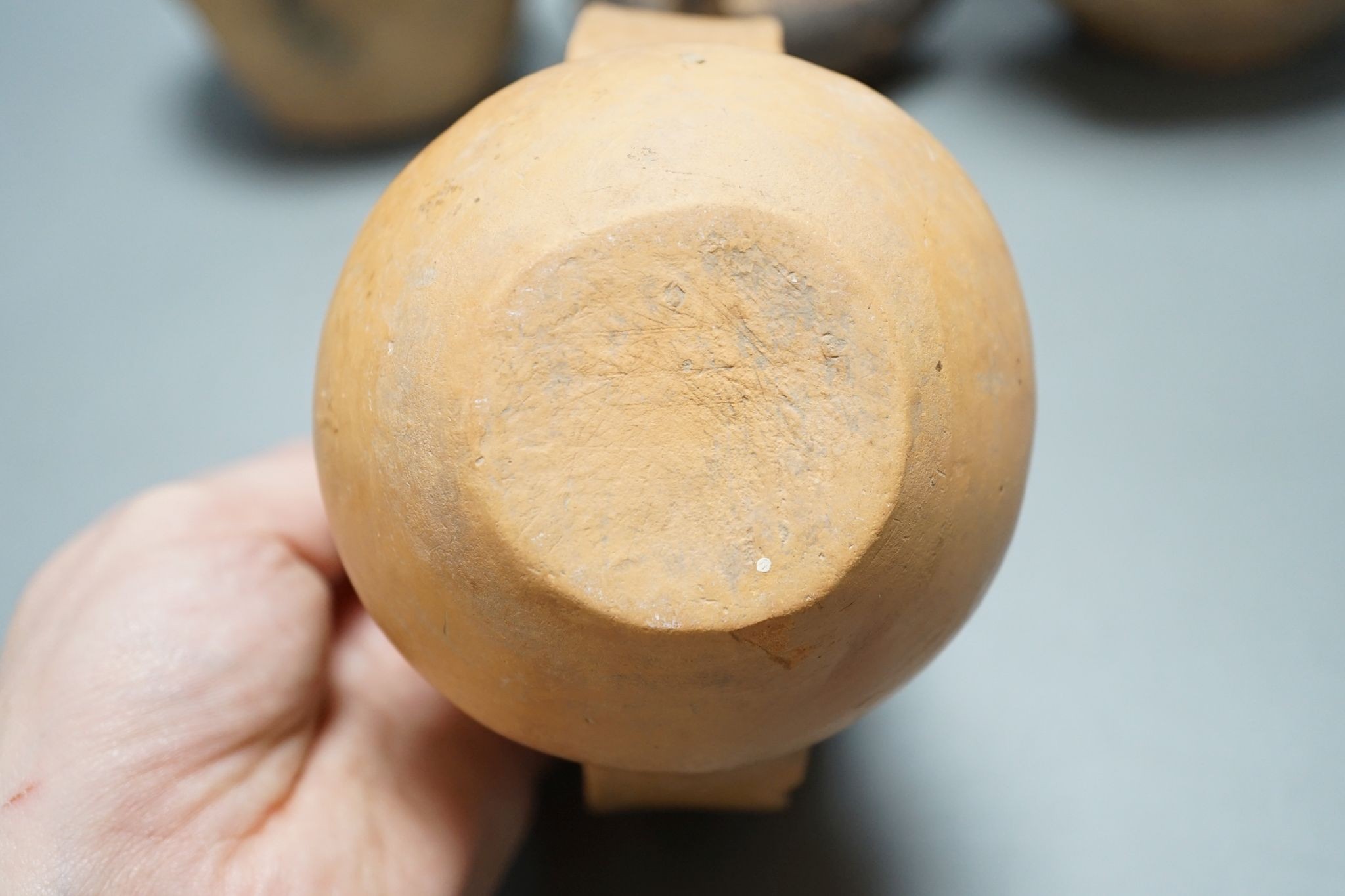 Four Chinese Neolithic pottery vessels, 11cm